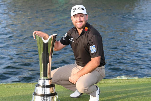 Graeme McDowell poses with the trophy at the Royal Greens Golf and Country Club 