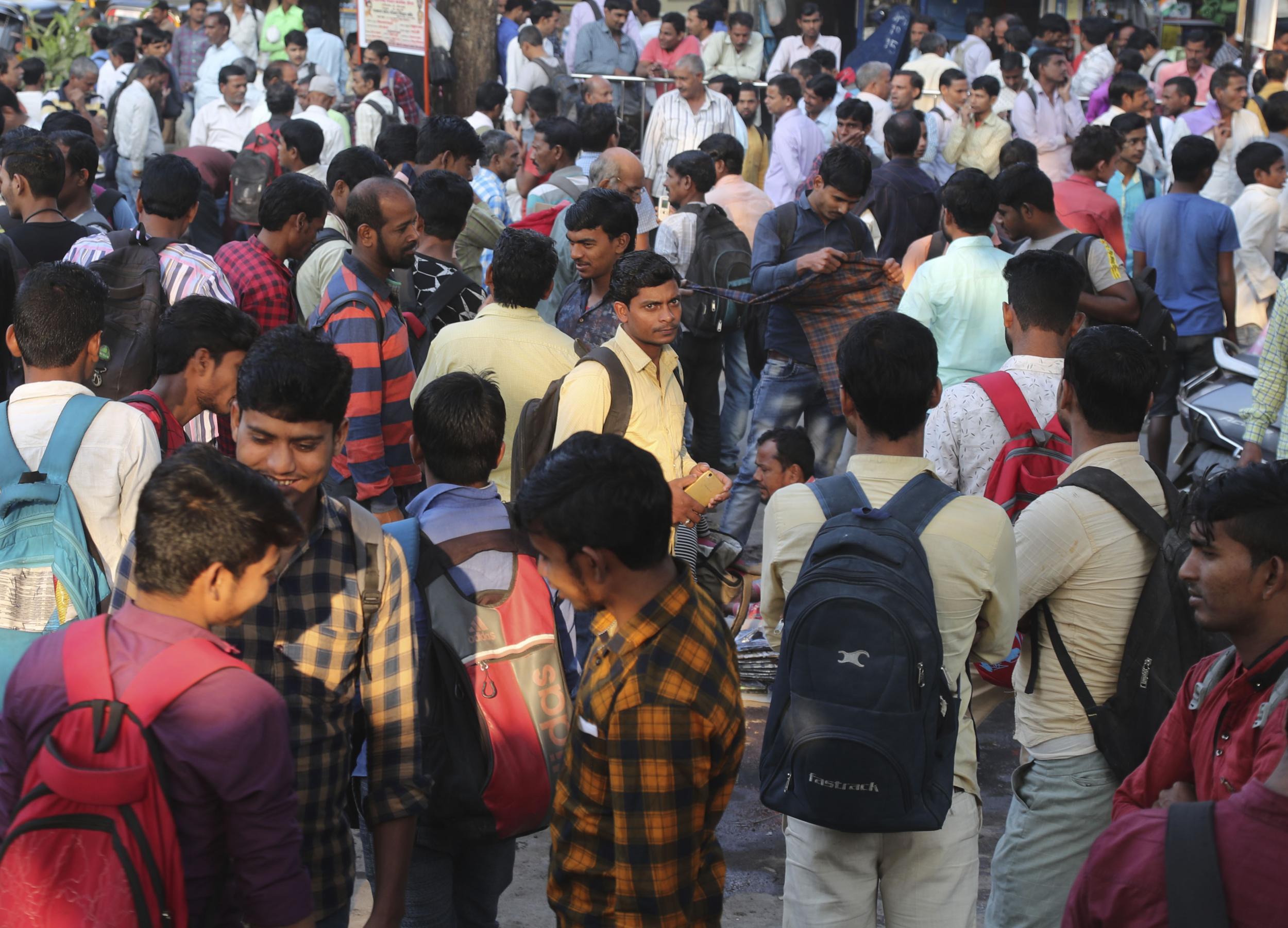 Indian daily wage laborers wait to get hired in Mumbai, India, Saturday, Feb 1, 2020 (AP Photo/Rafiq Maqbool)