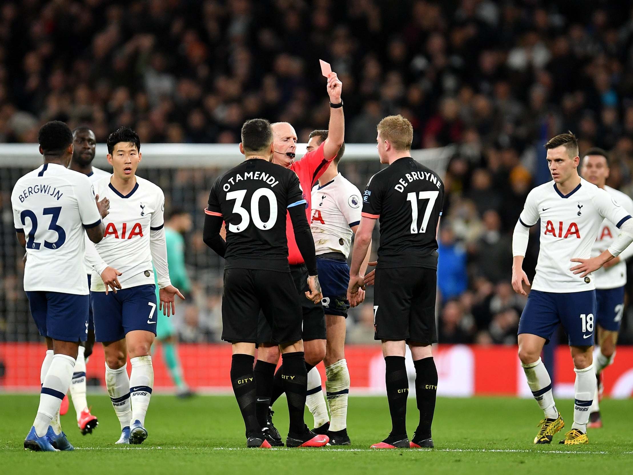 Mike Dean shows a red card to Oleksandr Zinchenko