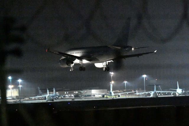An aircraft bringing British nationals from Wuhan in China lands at RAF Brize Norton in Oxfordshire