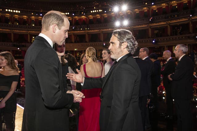 Prince William speaks with Joaquin Phoenix at the Baftas