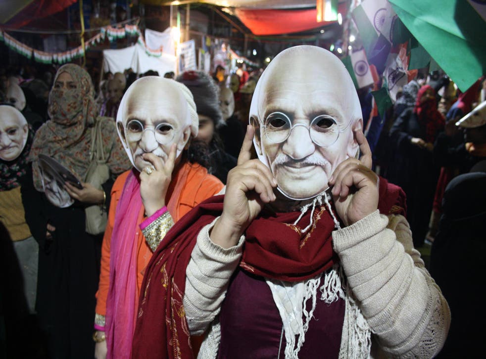 Women wear masks at the Shaheen Bagh protest on Martyr’s Day, the anniversary of Mahatma Gandhi’s assassination