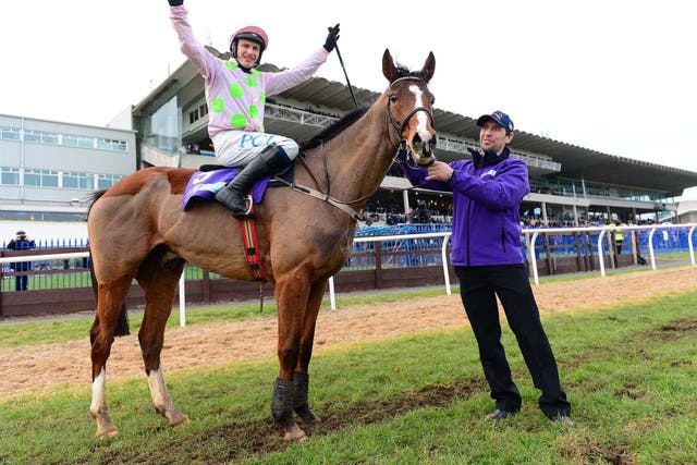 Faugheen and Paul Townend with groom John Codd celebrate after The Flogas Novice Chase