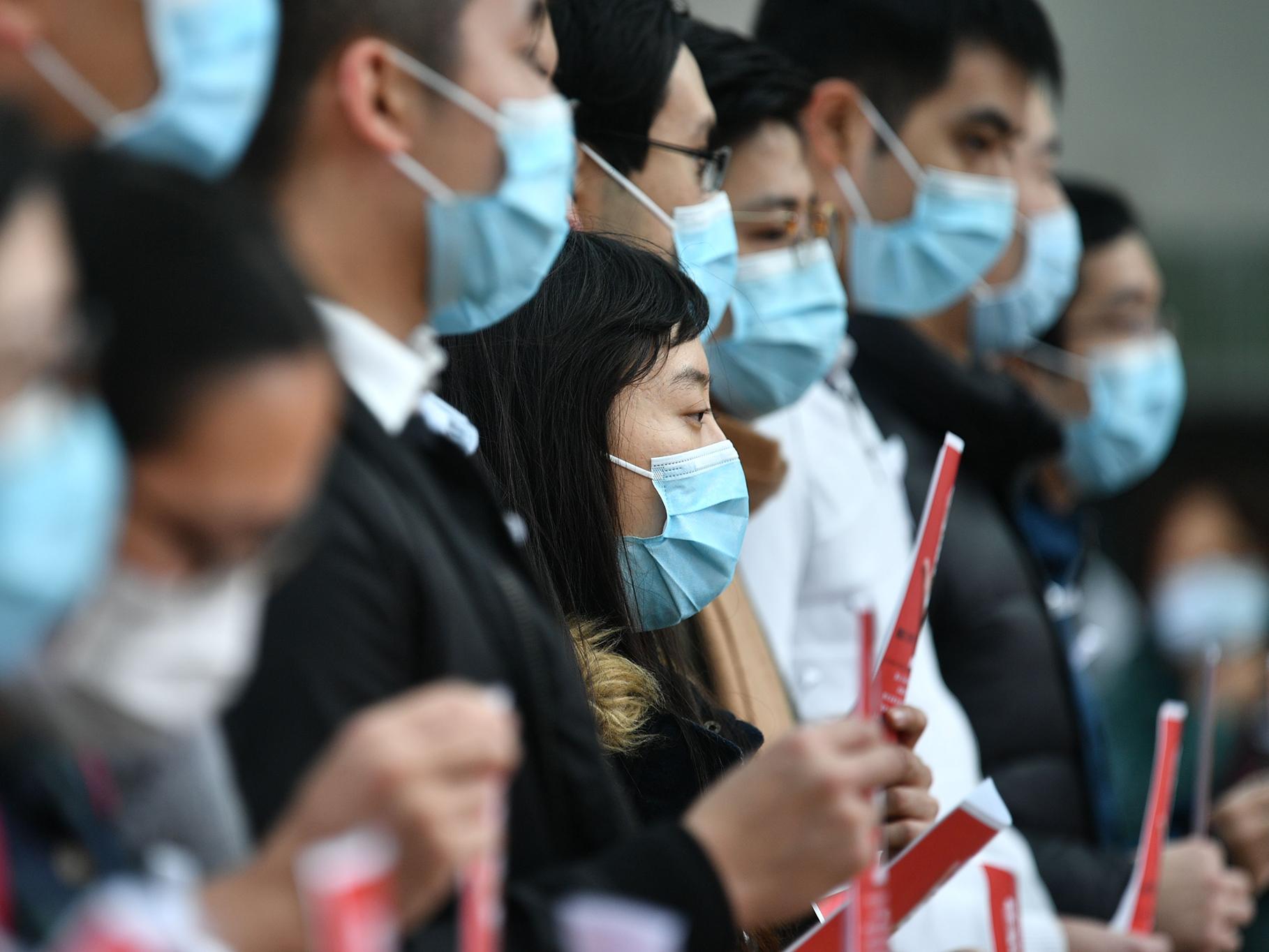 Thousands of medical workers have gone on strike to pressure the government into a full closure of the border with China