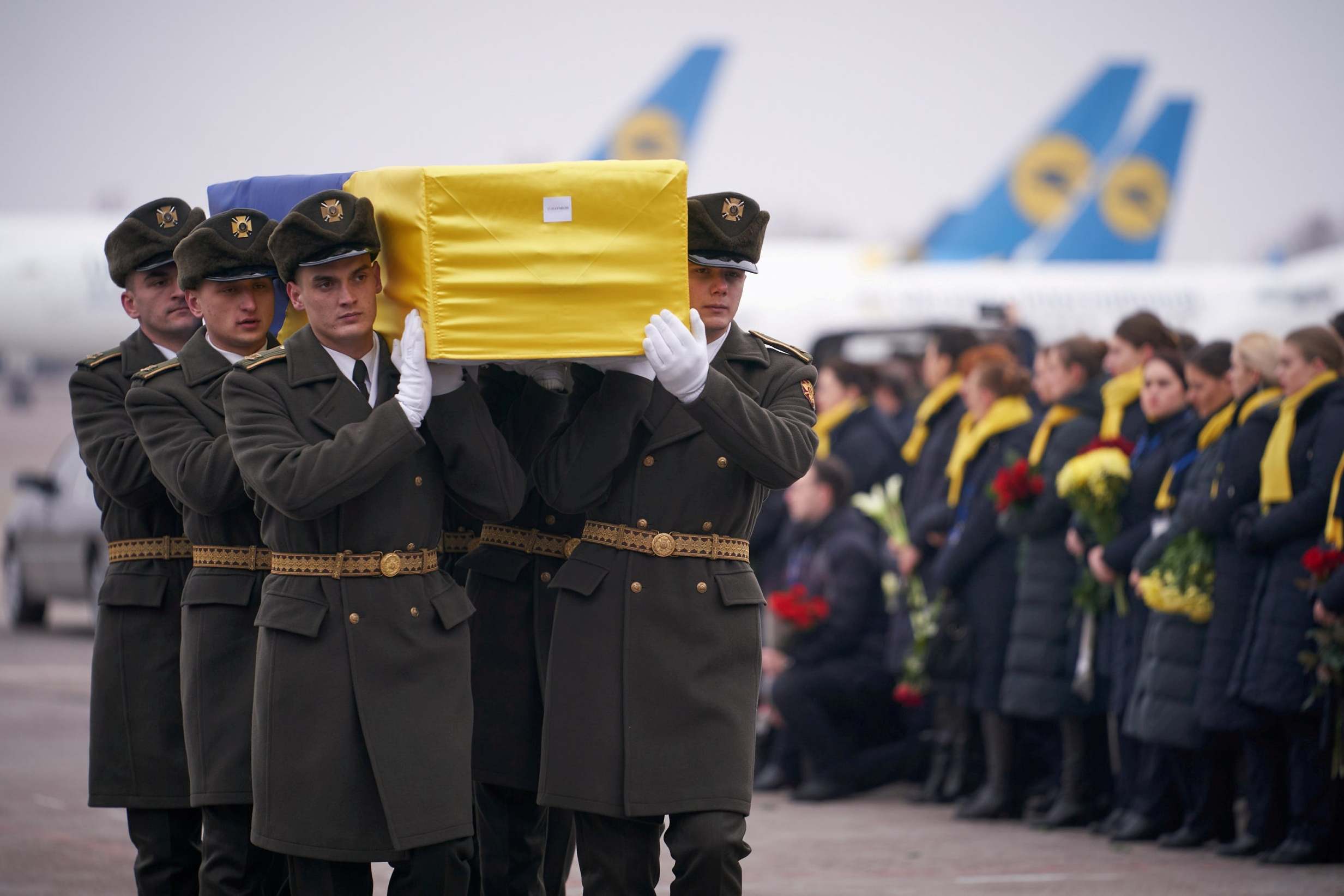 Soldiers carry a coffin containing the remains of one of the 11 Ukrainian victims (Reuters)