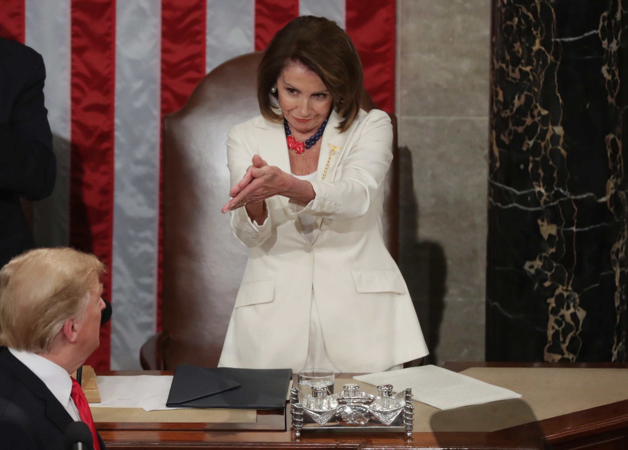 Nancy Pelosi applauds Donald Trump during the 2019 State of the Union address