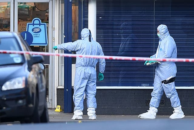 Forensic officers at the scene of the attack on Streatham High Road