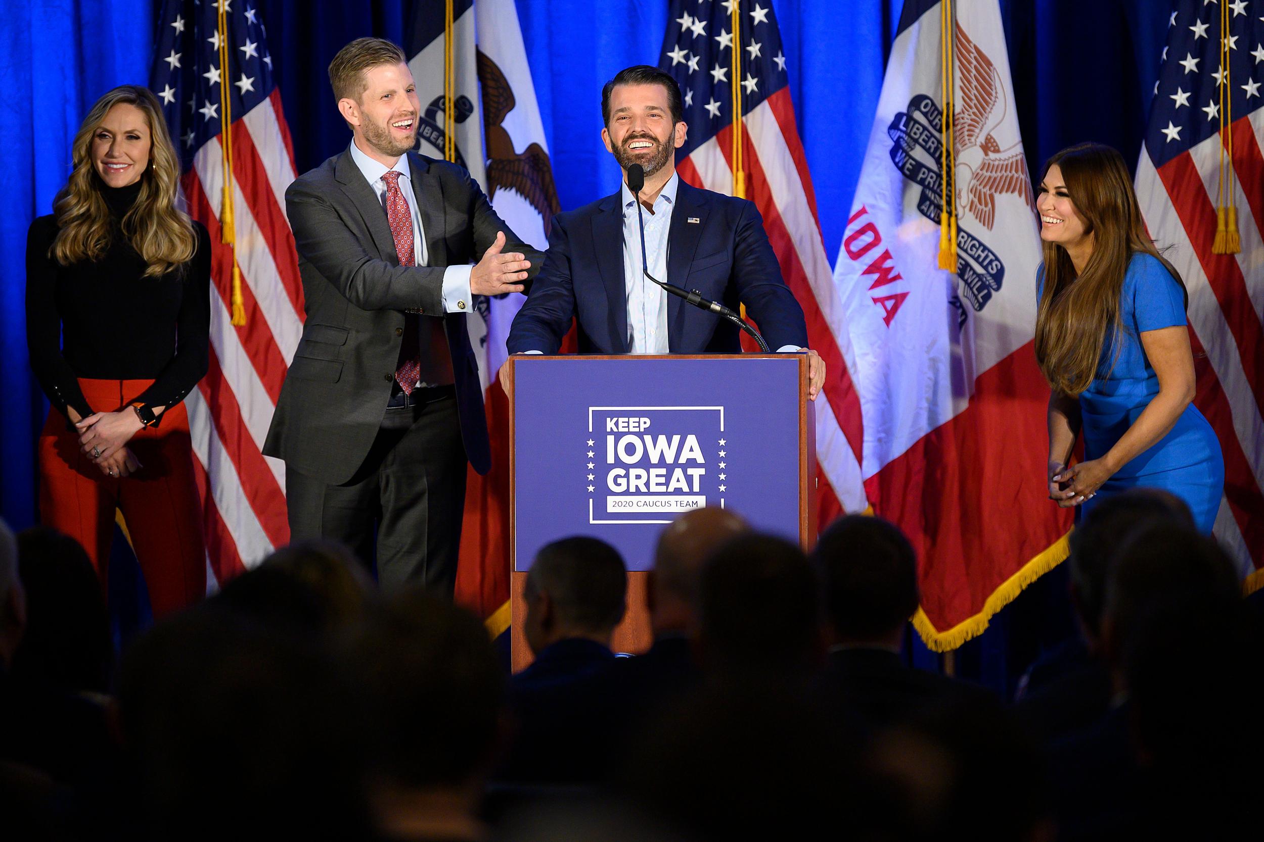 Donald Trump Jr speaks with his brother Eric and wife Lara, as well as his girlfriend Kimberly Guilfoyle during a "Keep Iowa Great" press conference in Des Moines on February 3, 2020