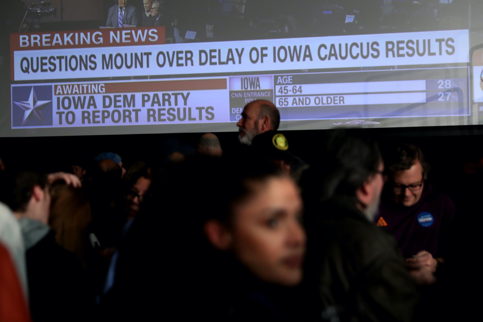 Supporters of democratic presidential candidate Sen. Bernie Sanders (I-VT) wait for results to come in at his caucus night watch party on February 03, 2020 in Des Moines, Iowa