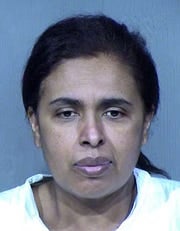 Adoptive parents arrested after body of 11-year-old is found hidden in attic 