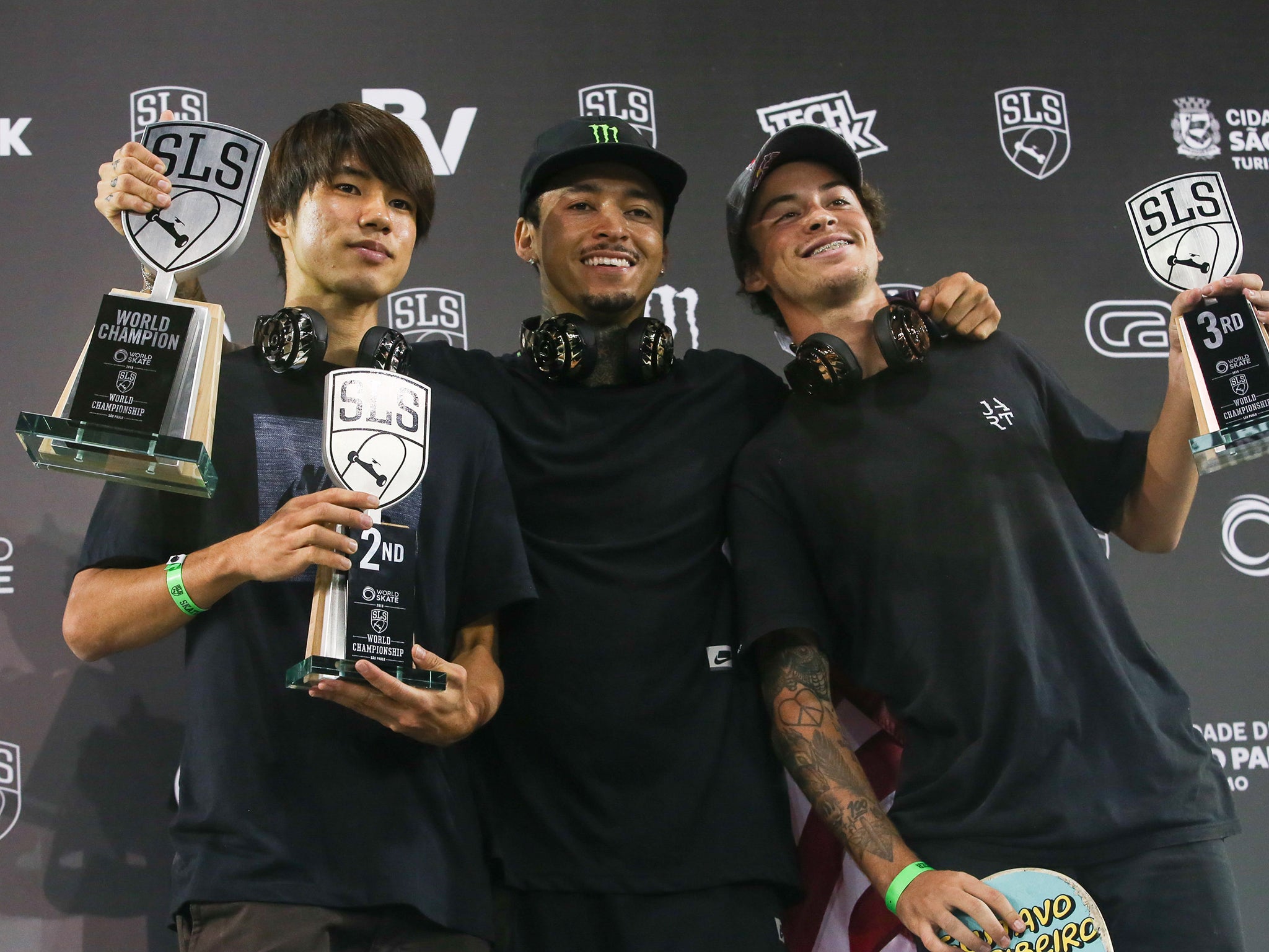 Yuto Horigome of Japan (left), alongside American Nyjah Huston (centre) and Gustavo Ribeiro of Portugal, after placing second in the WS/SLS 2019 World Championship in Sao Paulo, Brazil