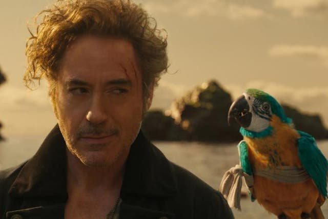 Robert Downey Jr as Dr John Dolittle alongside a talking parrot voiced by Emma Thompson