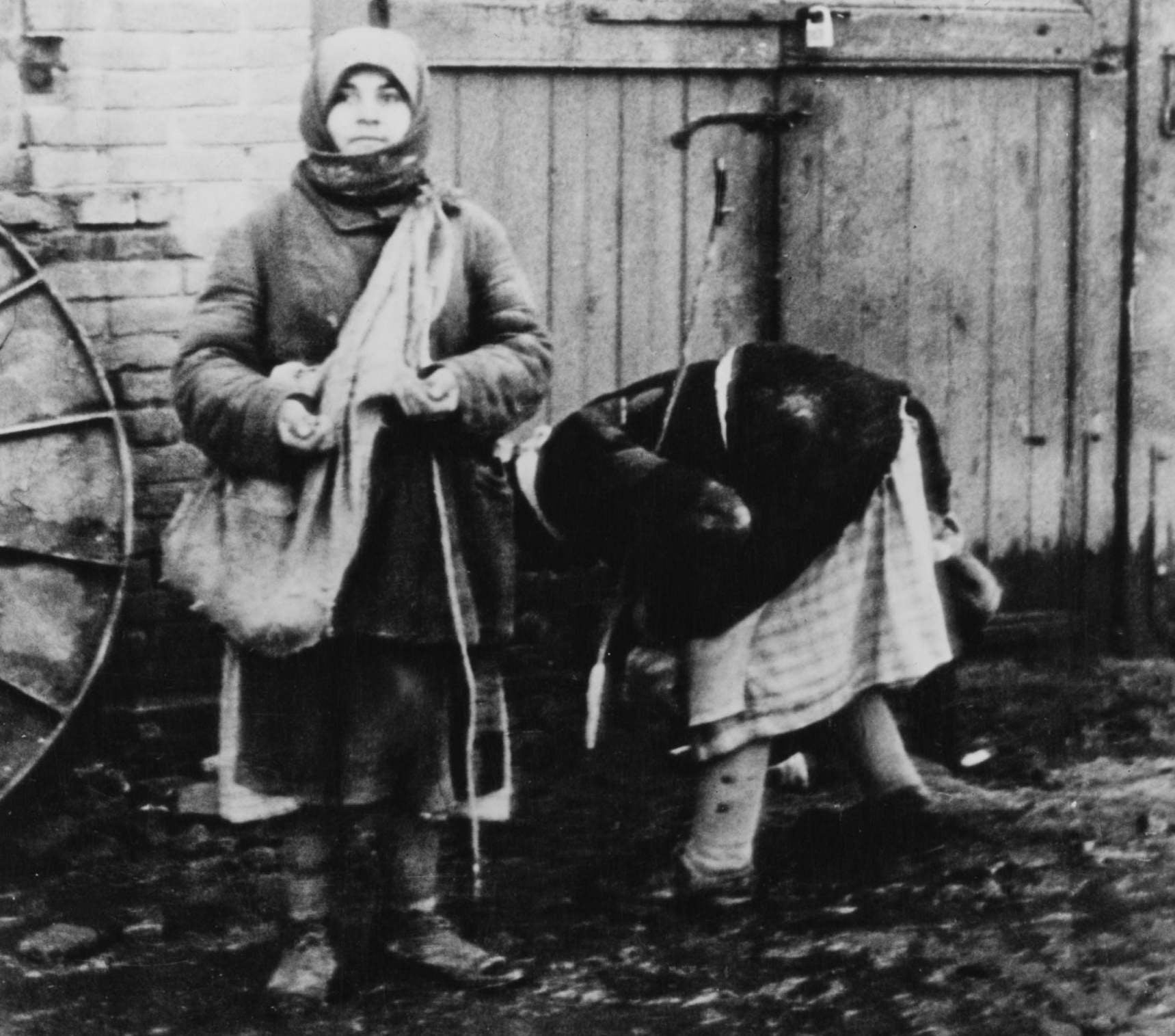 Peasant women collect fallen grain on a collective farm near Belgorod, Ukraine, in 1934