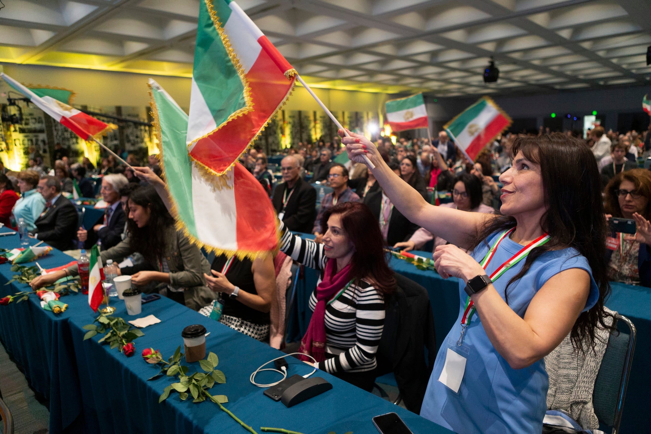 Iranian Americans wave Iranian opposition flags at the '2020 LA Convention for Free Iran'