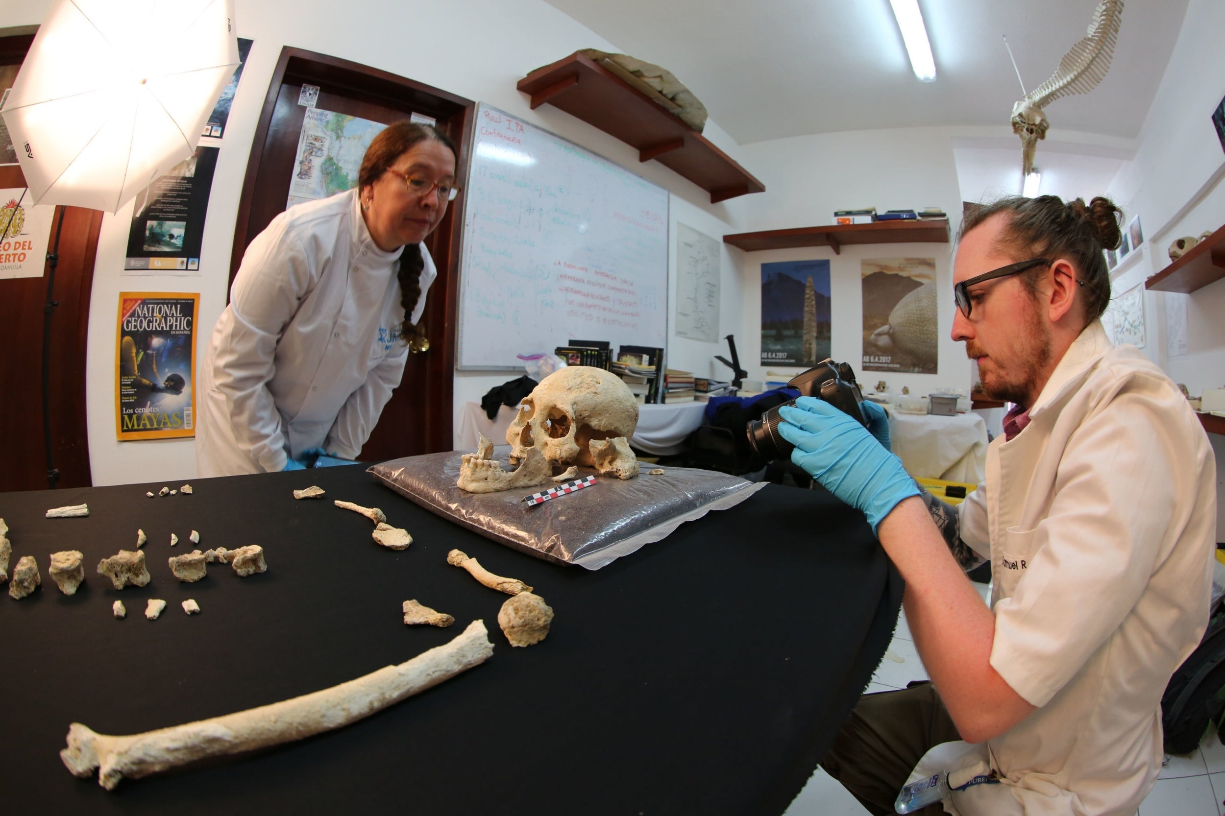 Professor Silvia Gonzalez (left) and Dr Sam Rennie with the Chan Hol 3 skeleton found in an underwater cave near the eastern Mexico town of Tulum
