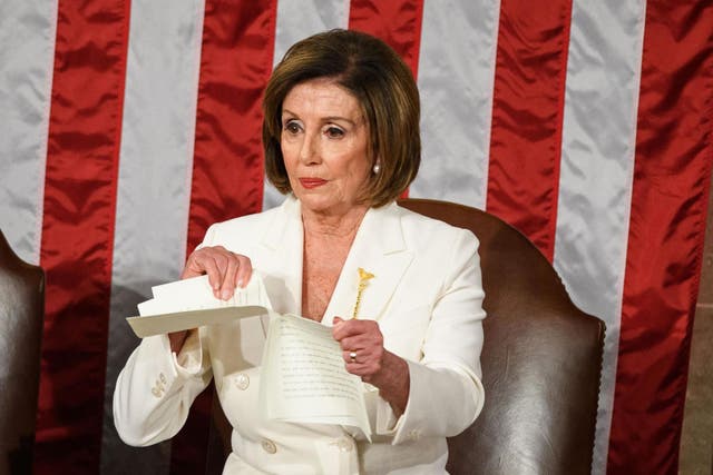 Speaker of the US House of Representatives Nancy Pelosi rips a copy of President Donald Trump's speech after he delivers the State of the Union address at the US Capitol in Washington, DC, on 4 February 2020.