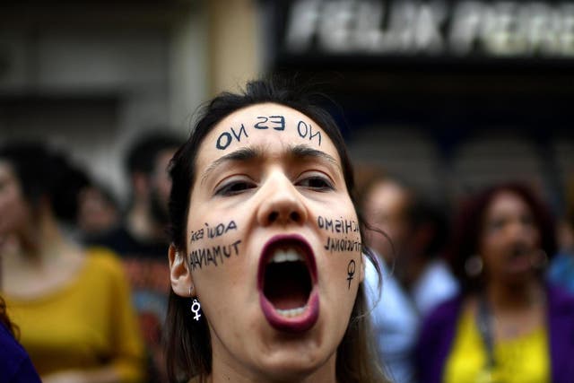 A woman shouts slogans during a demonstration in Madrid on April 26 2018, to protest after five men accused of gang raping a woman at Pamplona's bull-running festival were sentenced for "sexual abuse"