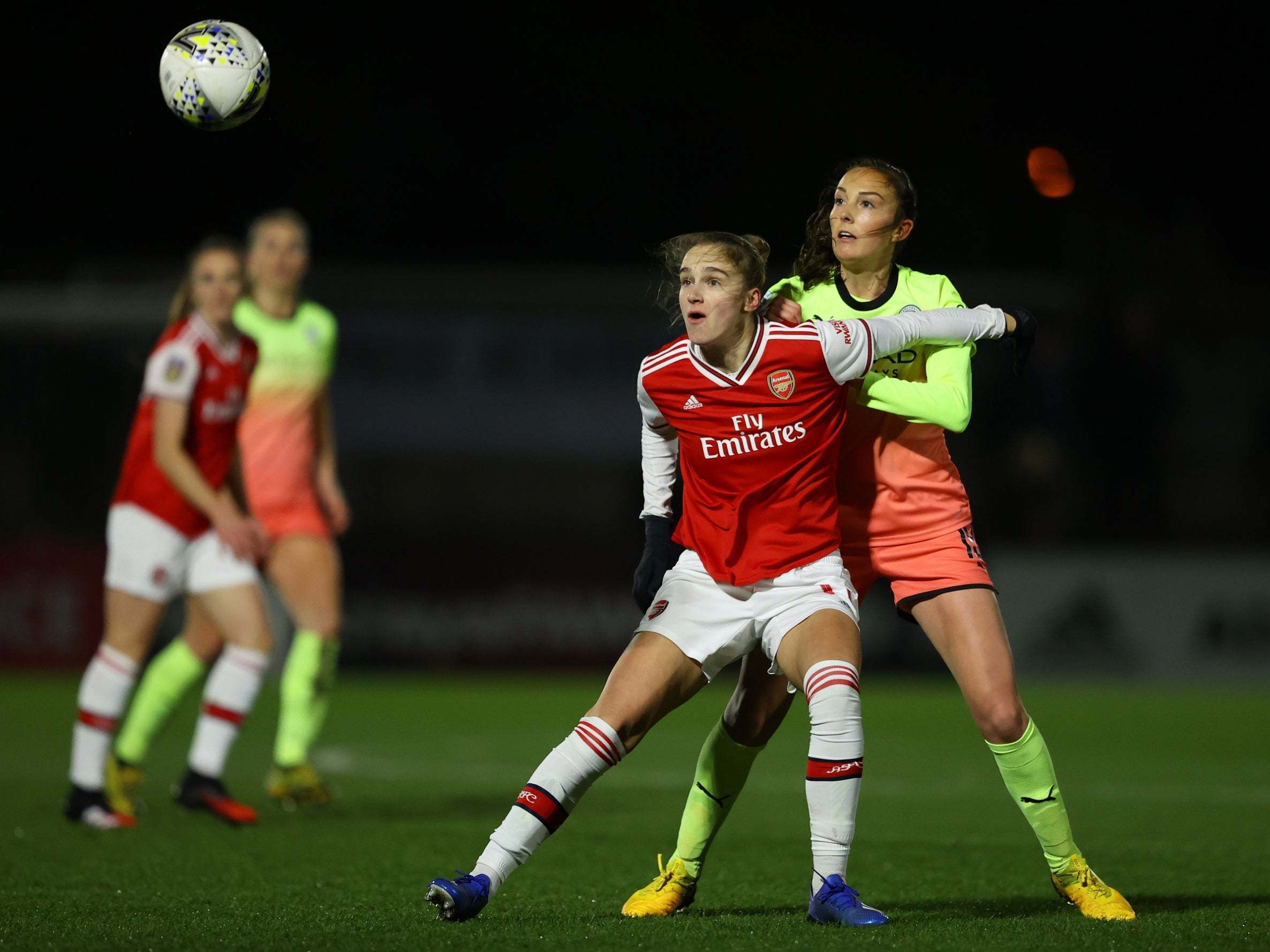 Vivianne Miedema holds off Caroline Weir against Manchester City