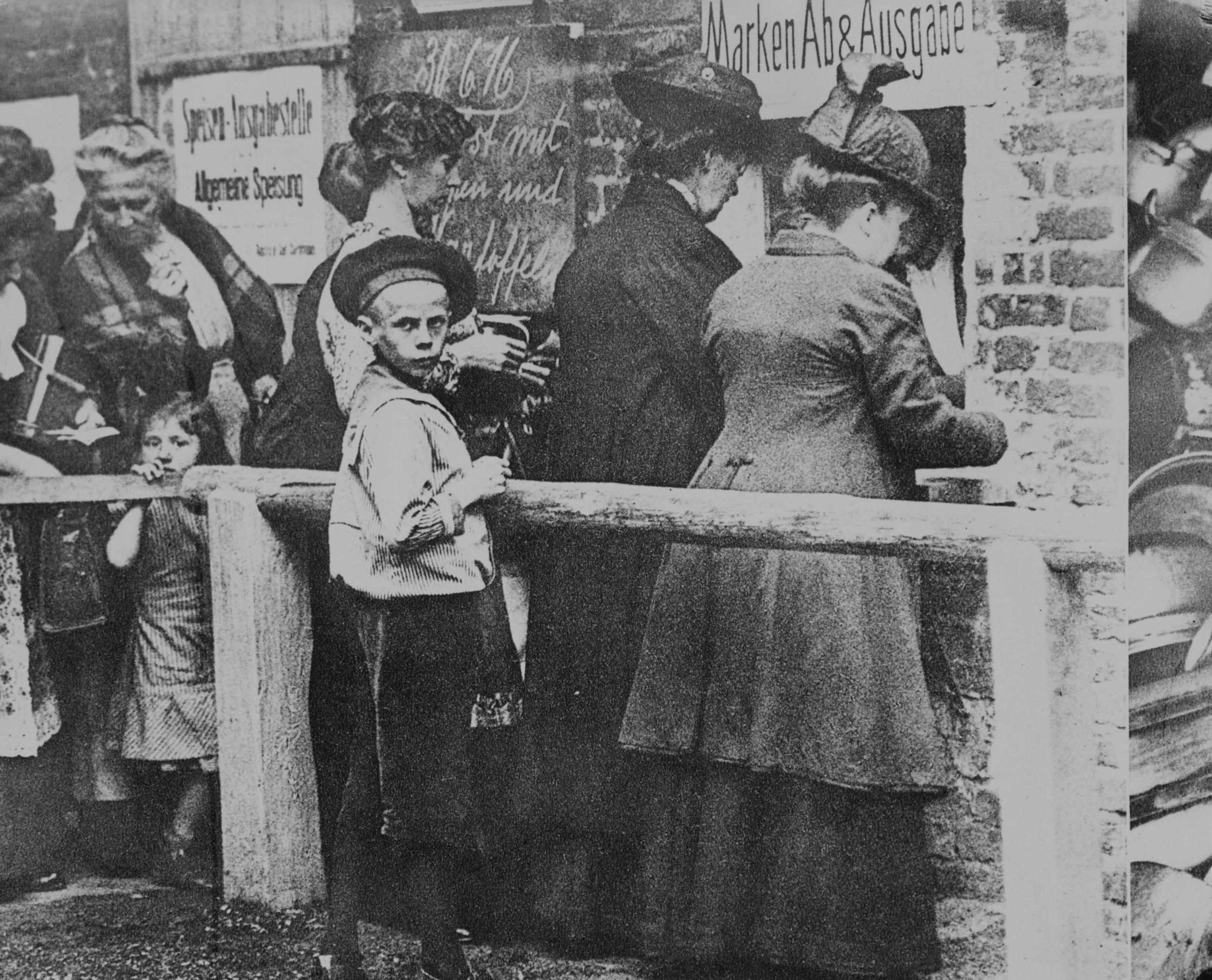 German housewives queue for new ration books in 1918, as the effects of the Allied blockade are felt