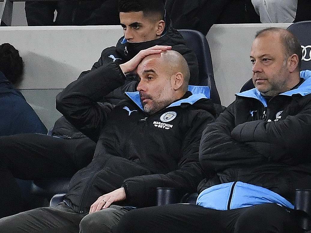 Pep Guardiola appears dejected after City succumb to Spurs