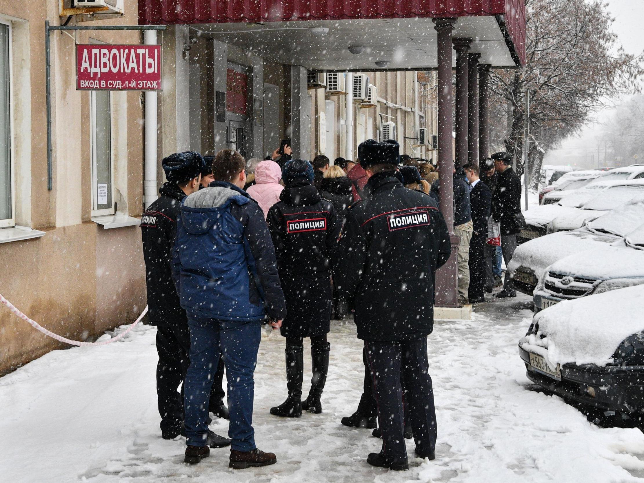 Members of the media and supporters of Dennis Christensen gather outside a courthouse after the verdict announcement in his trial, last year, in the town of Oryol 6 February 2019