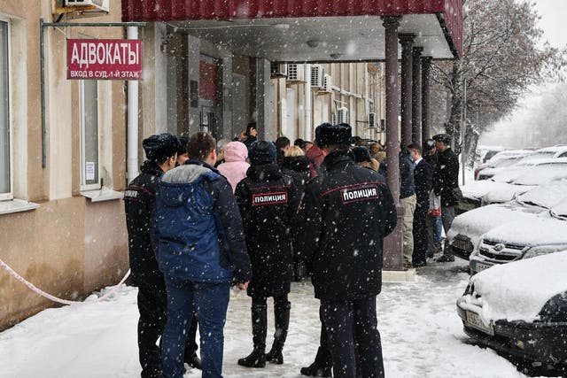 Members of the media and supporters of Dennis Christensen gather outside a courthouse after the verdict announcement in his trial, last year, in the town of Oryol 6 February 2019 