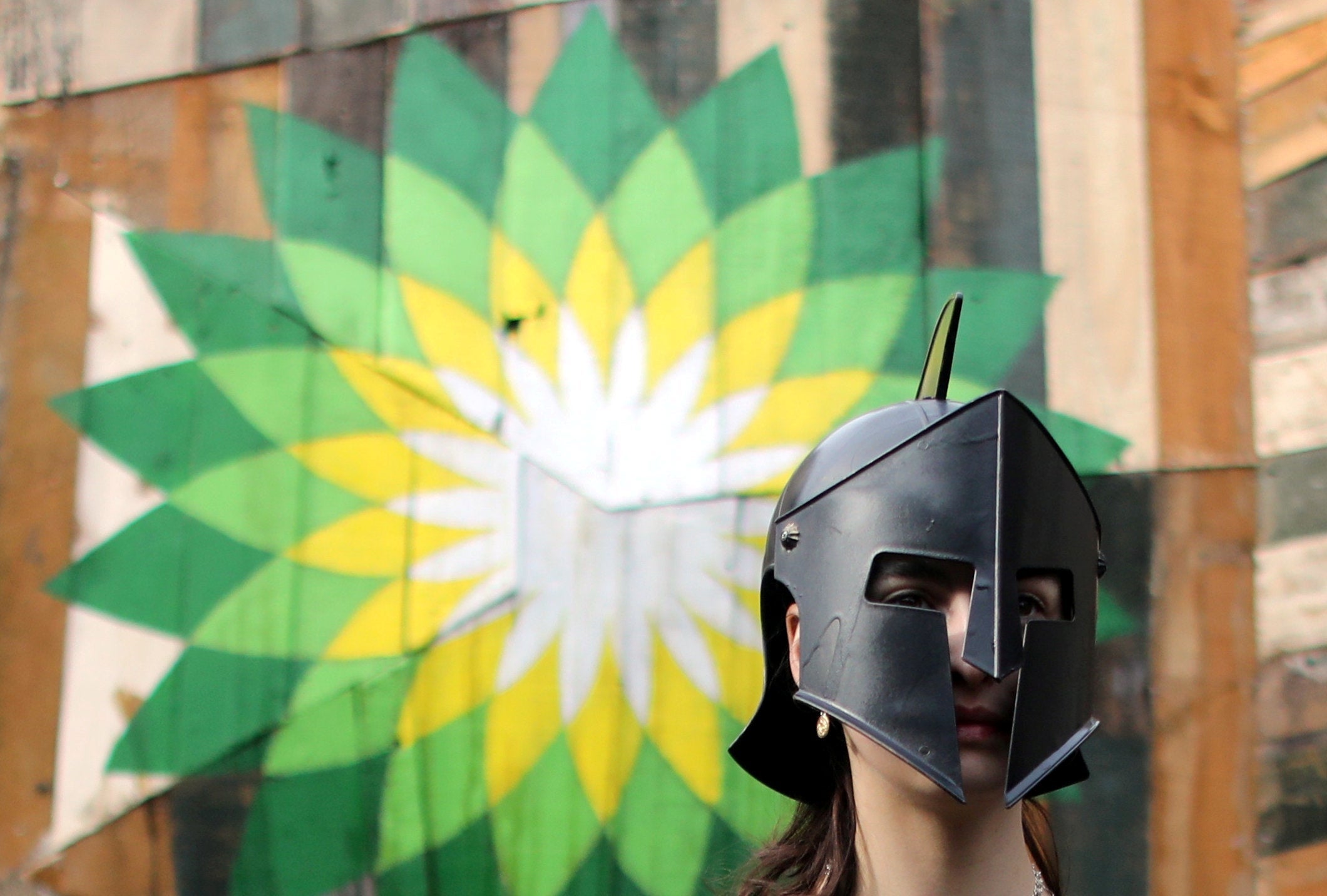 A climate change activist demonstrates against BP
