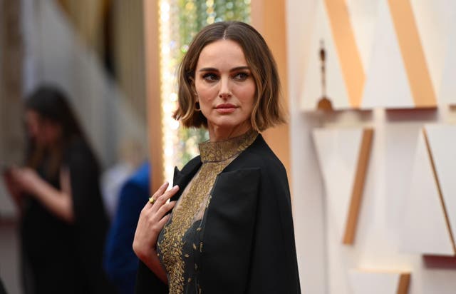 Natalie Portman on the red carpet, wearing the black Dior cape