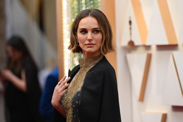 Natalie Portman on the red carpet, wearing the black Dior cape