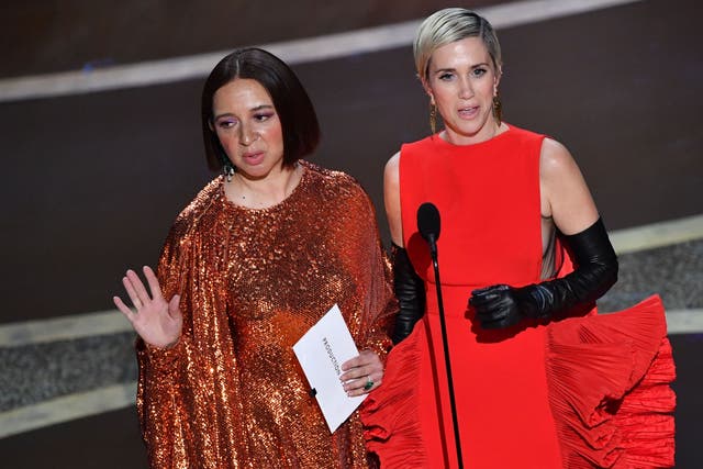 Maya Rudolph (L) and Kristen Wiig speak onstage during the 92nd Oscars at the Dolby Theatre in Hollywood, California