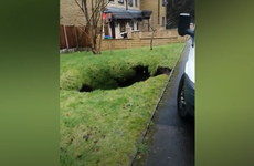 Large sinkhole caused by Storm Ciara opens up in garden