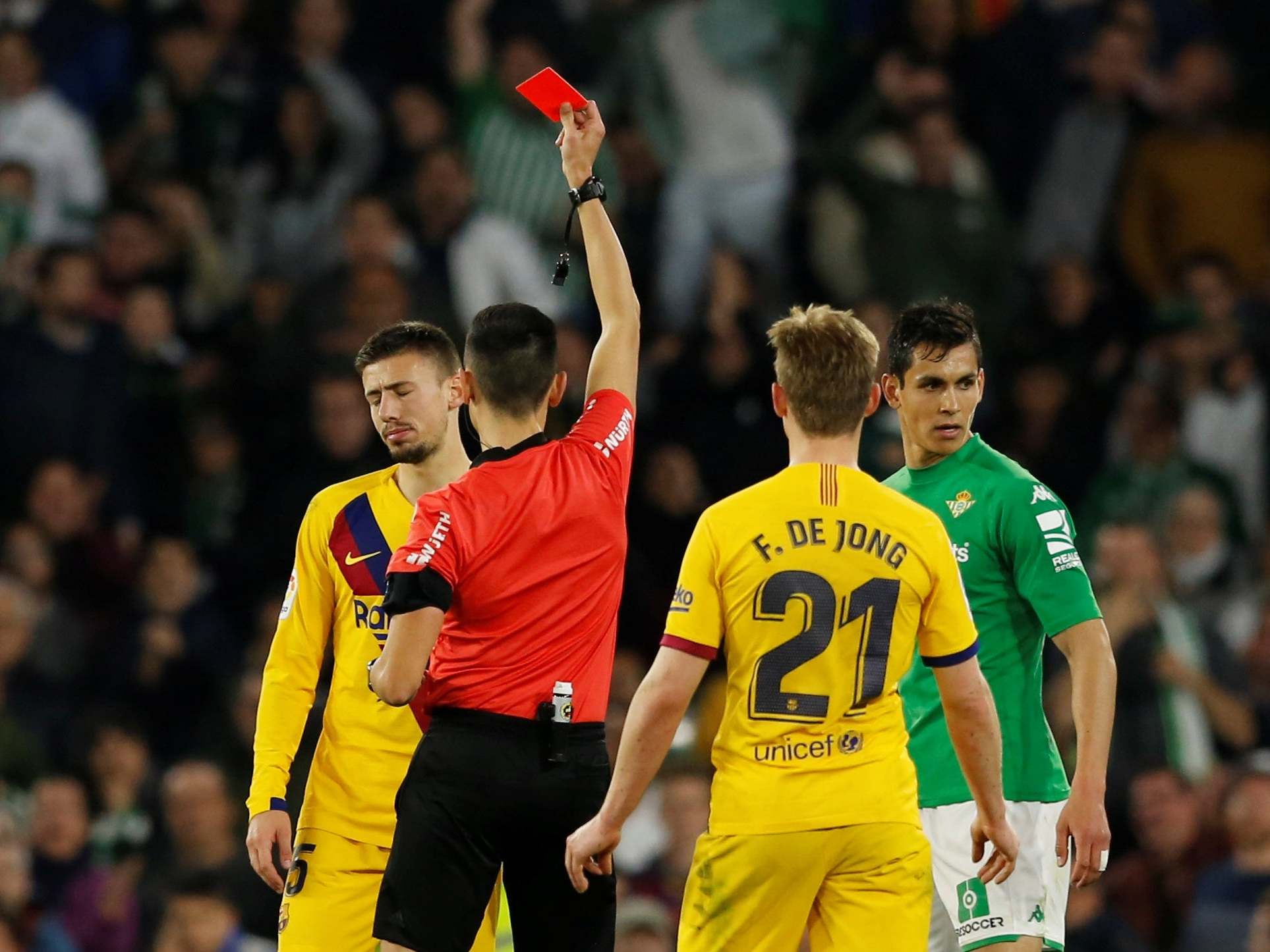 Barcelona's Clement Lenglet is shown a red card by referee Sanchez Martinez