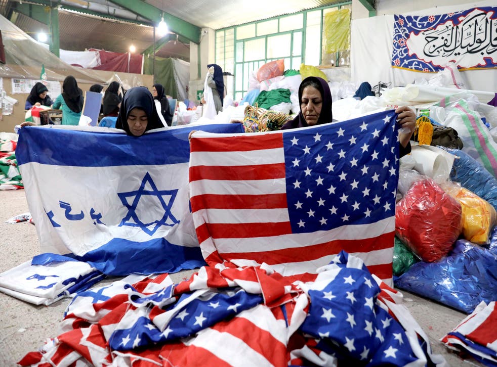Workers fold flags at the Diba Parcham Khomein factory