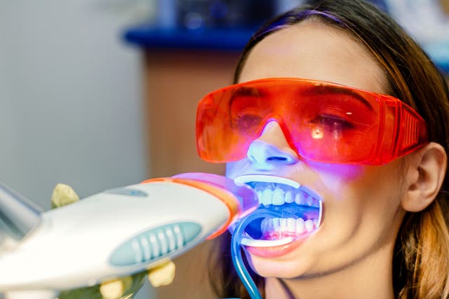 Stock image of a woman having her teeth whitened