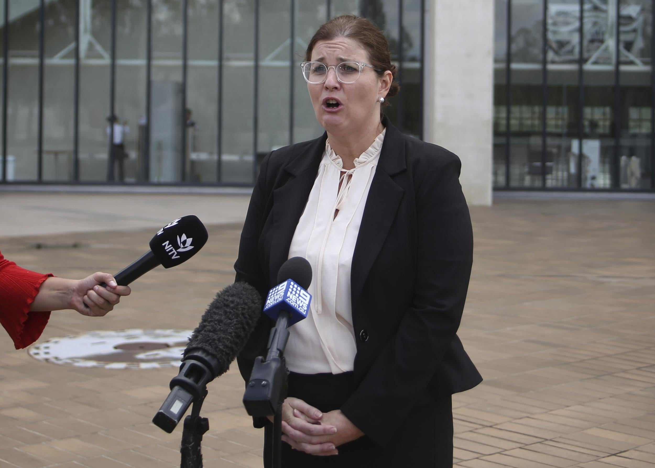 Lawyer Claire Gibbs speaks to reporters outside the High Court in Canberra