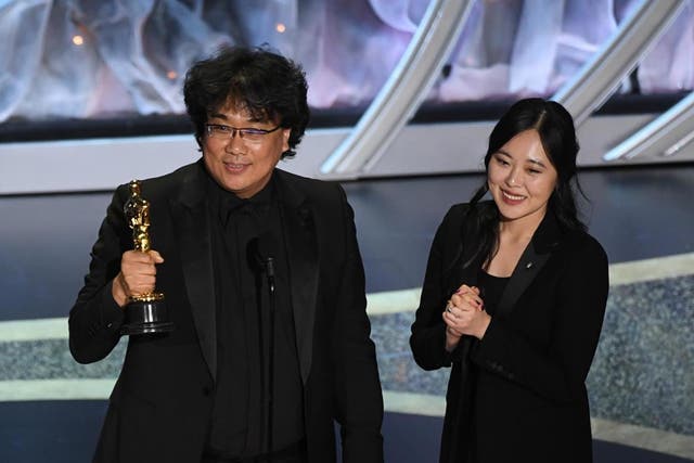 Bong Joon-ho, left, has described subtitles as a 'one-inch barrier'