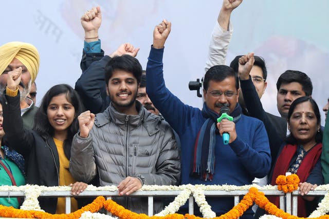 Arvind Kejriwal (second from right), Aam Aadmi Party (AAP) chief and chief minister of Delhi, celebrates with his wife Sunita Kejriwal and children