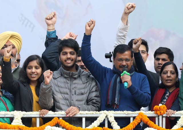 Arvind Kejriwal (second from right), Aam Aadmi Party (AAP) chief and chief minister of Delhi, celebrates with his wife Sunita Kejriwal and children