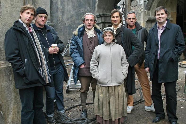 Kehlmann (far left) onset of the film adaptation of his novel ‘Measuring the World’ alongside cast and crew including director Detlev Buck (second from left)