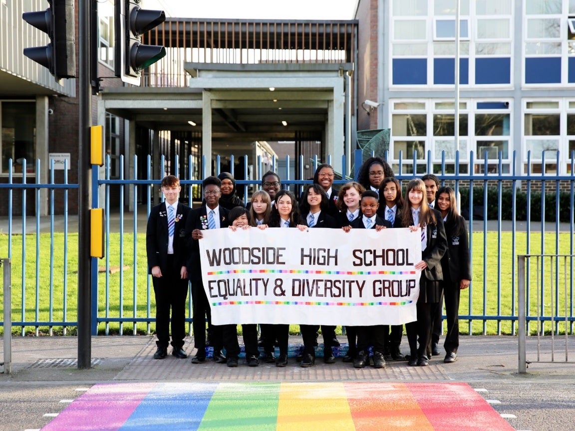 The head of Woodside High School said the abuse will not deter her from continuing equality work