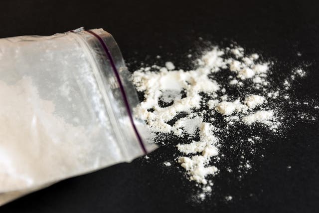 Drugs in a plastic bag on black background. stock photo