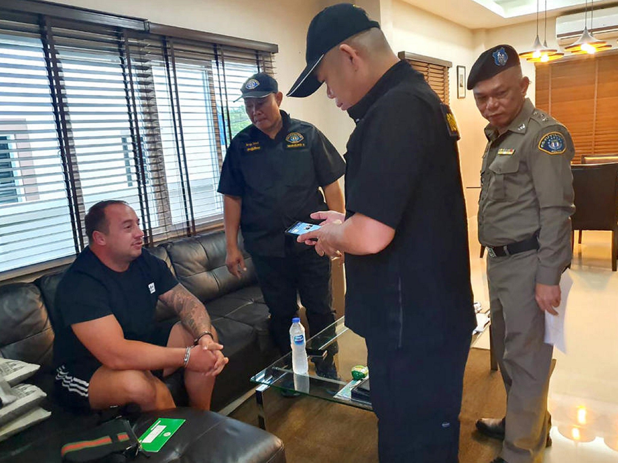 A Thai police handout photo of Mark John Rumble, 31, (left) who has been named as one of two British prisoners being  tested for coronavirus at HMP Bullingdon, in Oxfordshire.