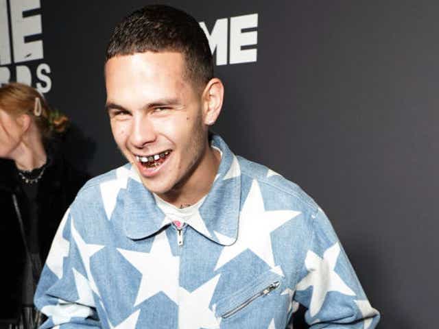 Slowthai drinks from a can of beer on the NME Awards red carpet last night