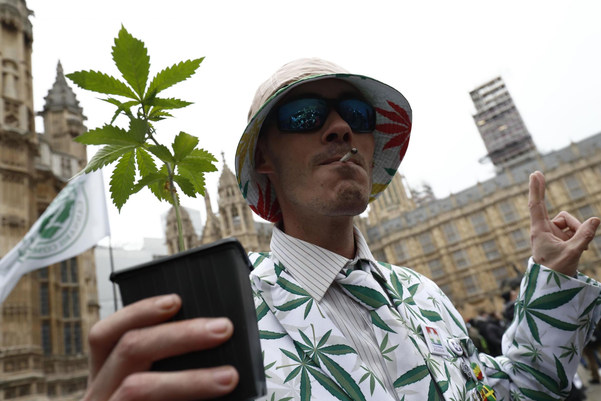 Campaigners gather outside parliament during a debate on the legalisation of cannabis for medical purposes in 2018 – the bill failed to pass