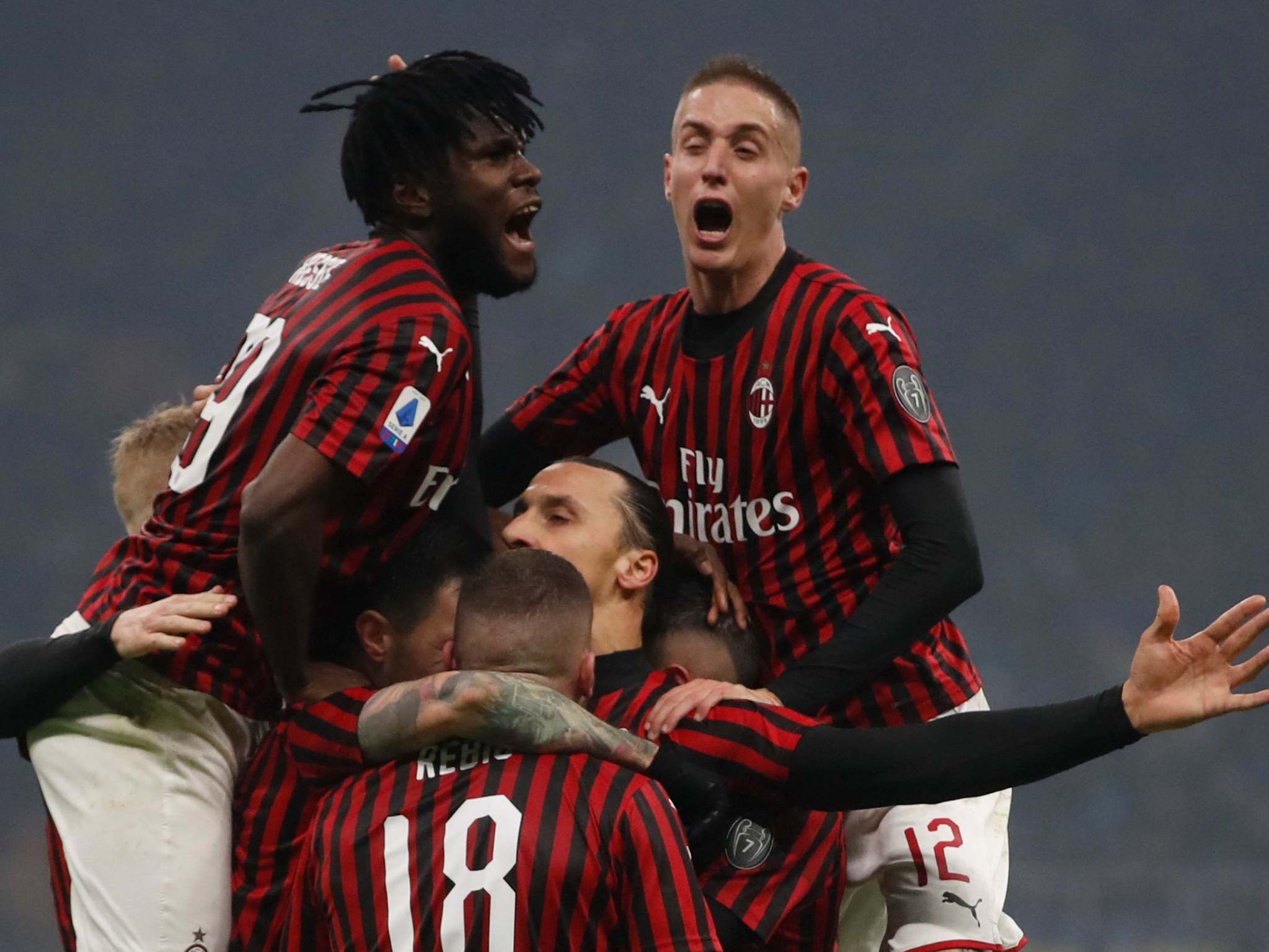 Ibrahimovic is mobbed after scoring in the Milan derby