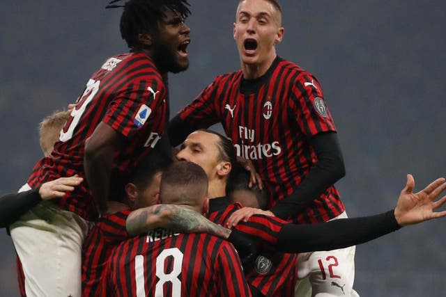 Ibrahimovic is mobbed after scoring in the Milan derby