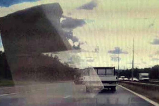 A screengrab of the police officer's webcam shows some polystyrene flying close to his vehicle.