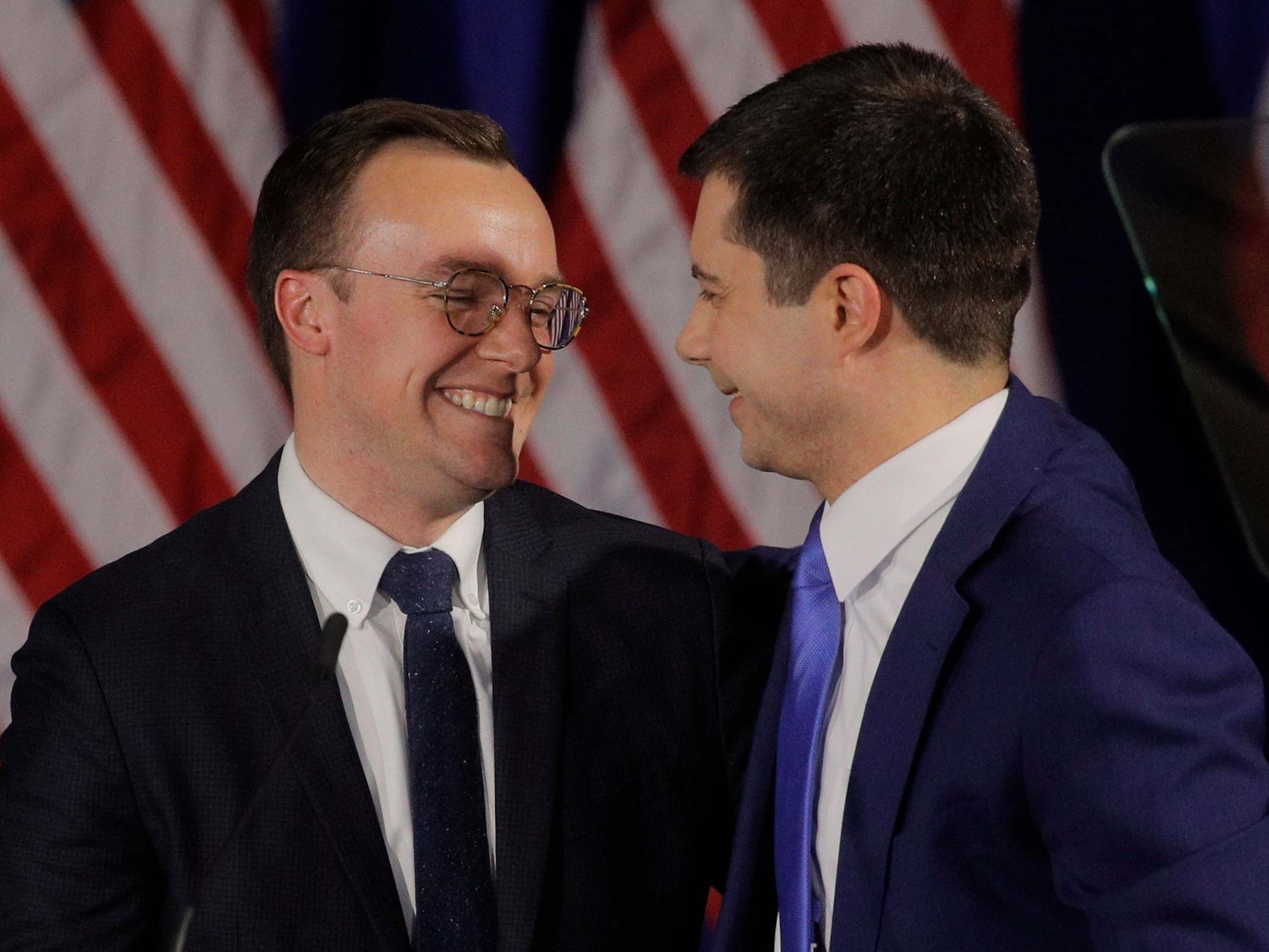 Democratic US presidential candidate and former South Bend Mayor Pete Buttigieg (right) looks at his husband Chasten at his New Hampshire primary night rally in Nashua, New Hampshire, US, 11 February, 2020.