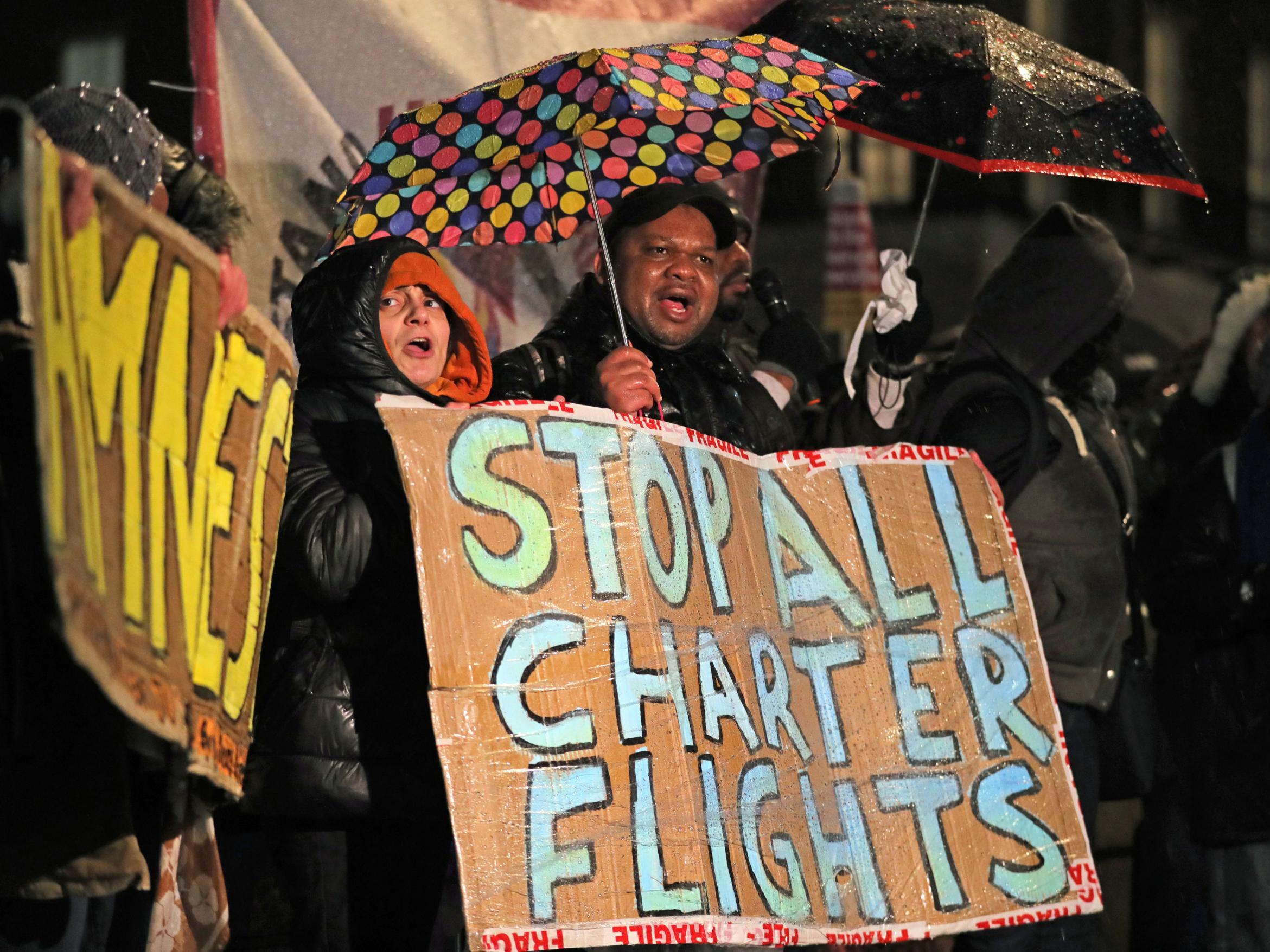 Campaigners outside No 10 protesting against the government's decision to go ahead with deporting people to Jamaica