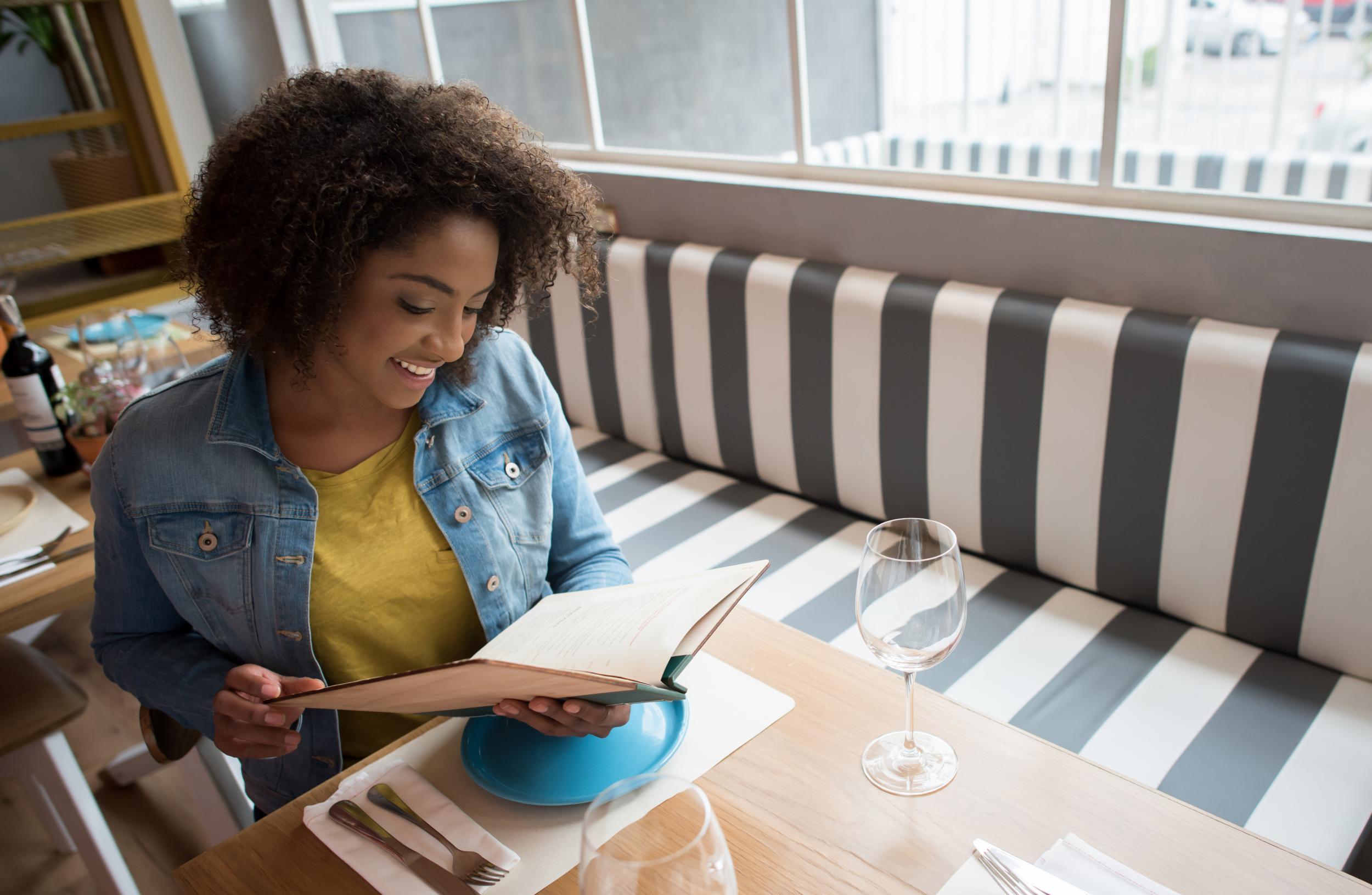 Bringing a book means you don't have to feel awkward eating alone (Stock)